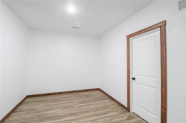 Empty room with light hardwood / wood-style floors | Image 44