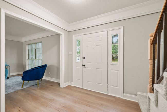 The interior entry is bright and clean with modern finishes. | Image 5
