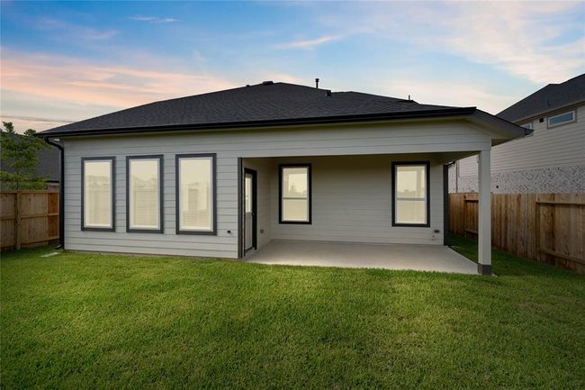 This amazing backyard with the covered patio provides enough space for many activities! From fun summer outdoor parties, to roasting marshmallows in the winter, this gorgeous backyard gives you the ability for many days/nights of memories! | Image 19
