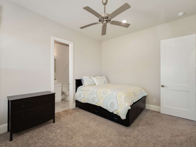 Guest bedroom features a private ensuite bath and walk-in closet | Image 24