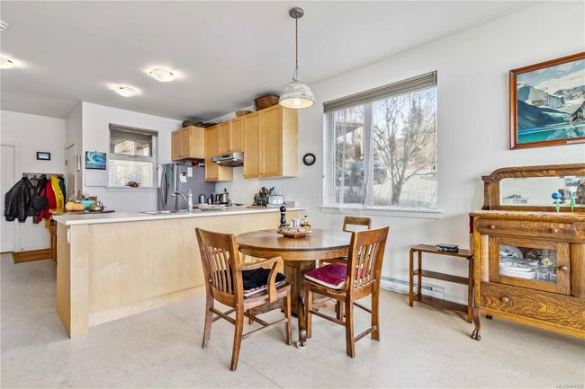 Dining room with baseboard heating | Image 16