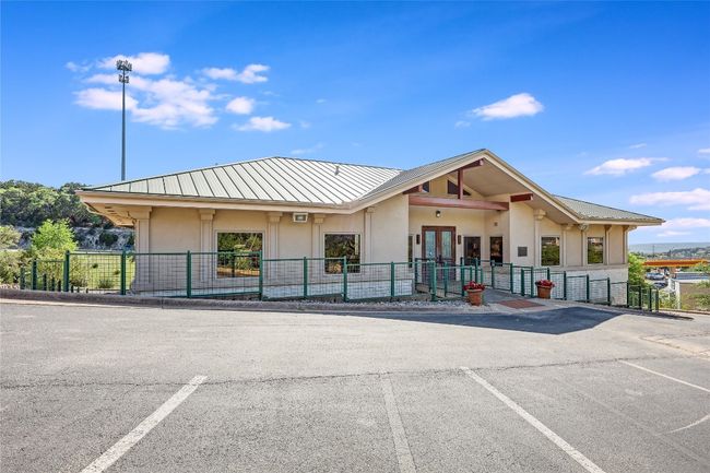 View of property featuring uncovered parking and fence | Image 4