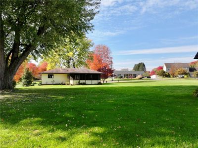 Back view of home on level lot | Image 2