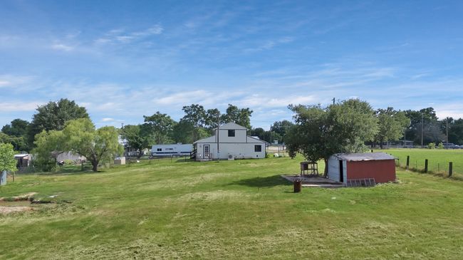 View of yard featuring an outdoor structure | Image 16