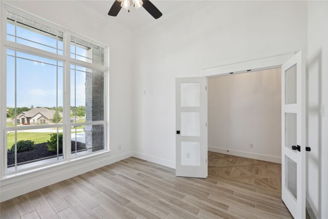 Unfurnished room with ornamental molding, ceiling fan, and light wood-type flooring | Image 6