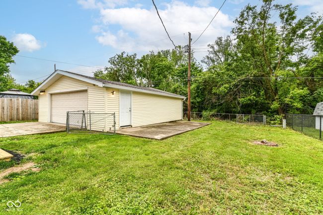 view of yard featuring an outbuilding and a detached garage | Image 35