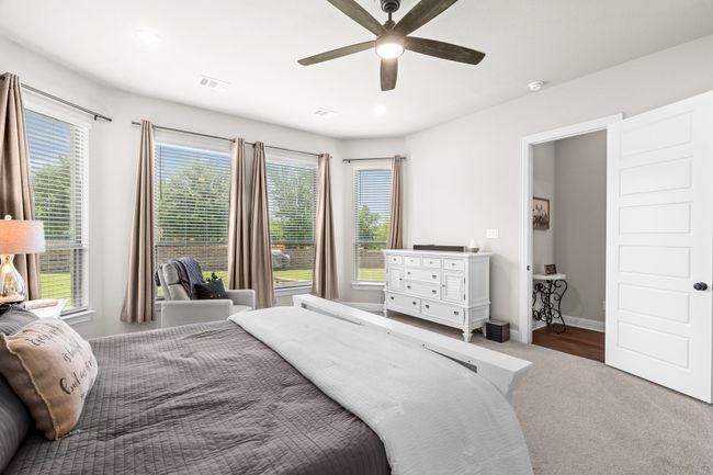 Bedroom featuring multiple windows, carpet flooring, ceiling fan, and recessed lighting | Image 19