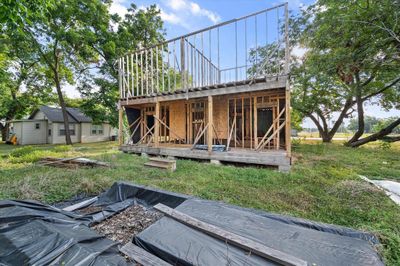 Back of property featuring a yard and a wooden deck | Image 2