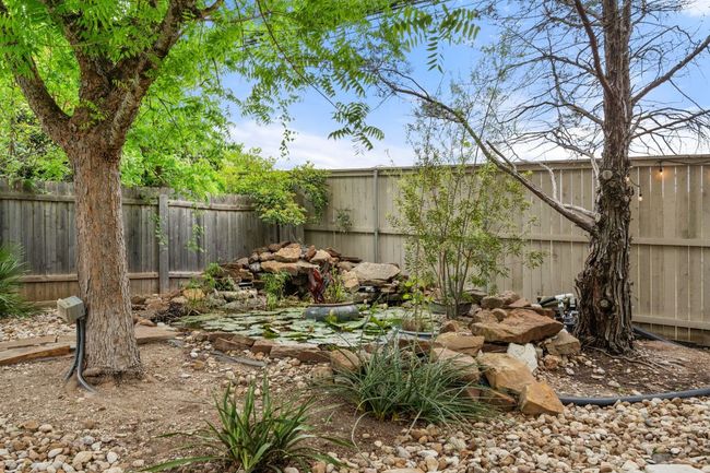 View of yard featuring a fenced backyard | Image 39