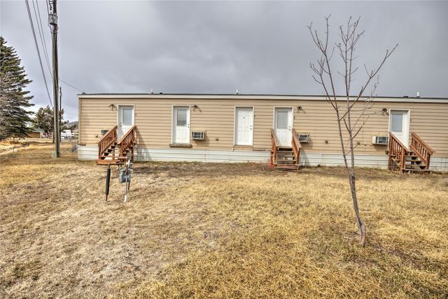 Rear view of house with entry steps | Image 10