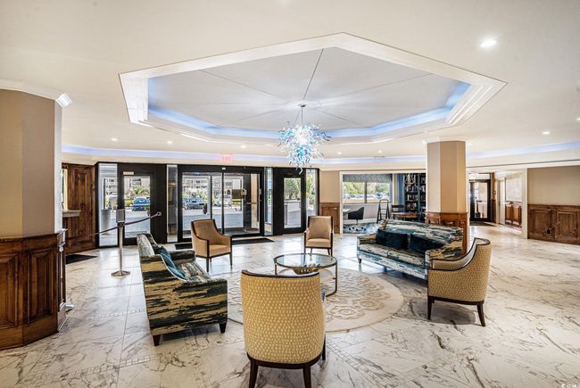 Lobby featuring ornamental molding, wainscoting, and recessed lighting | Image 25