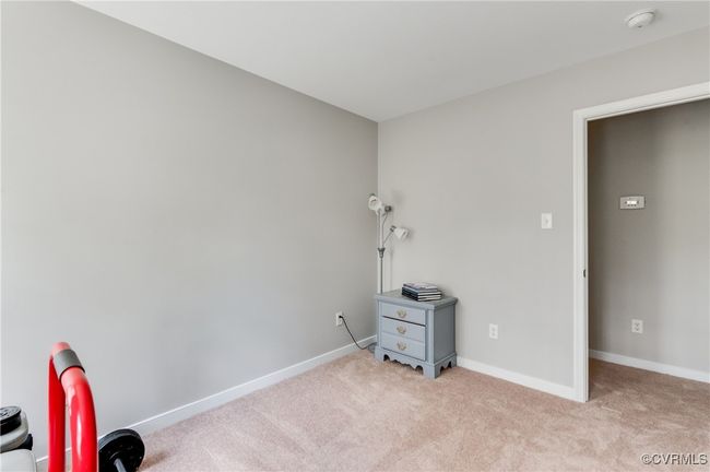 Bedroom with light colored carpet and baseboards | Image 21