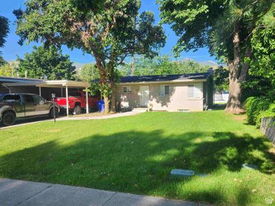 View of front of house with a carport and a front yard | Image 1