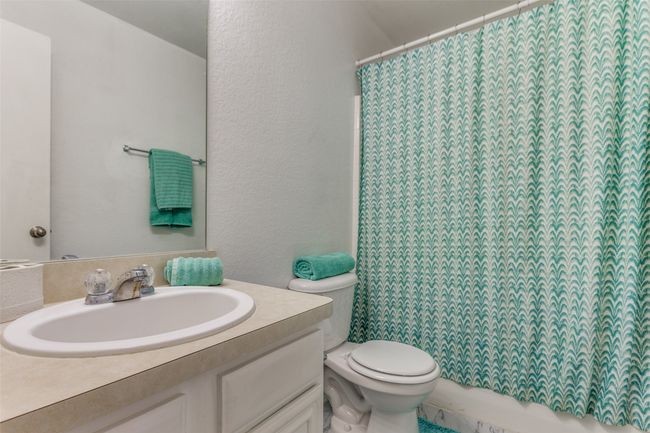 Bathroom featuring vanity and toilet | Image 14