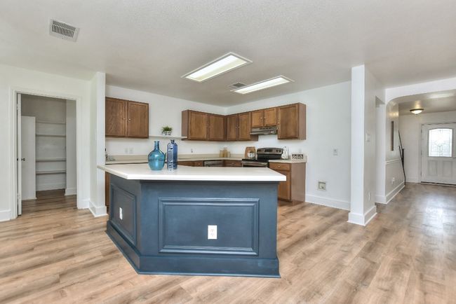 Huge center island offers lots of countertop space for prep and entertaining! | Image 14