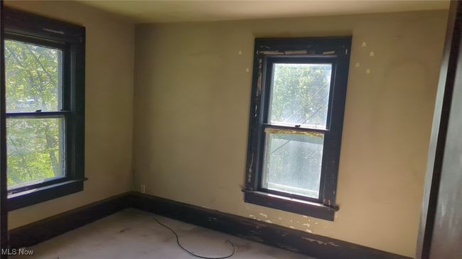 Unfurnished room with a healthy amount of sunlight and baseboards | Image 10