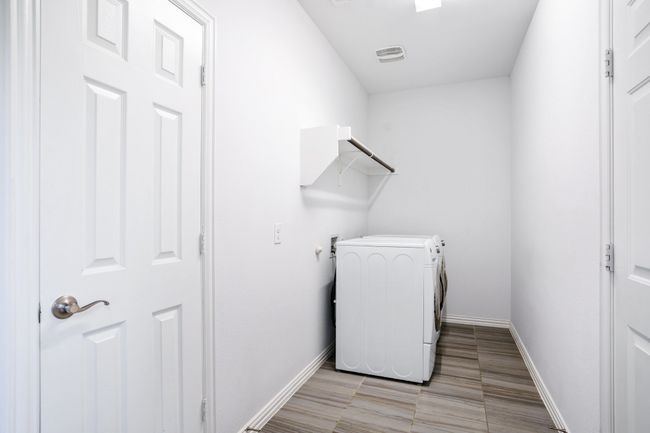 Laundry room with independent washer and dryer and baseboards | Image 18