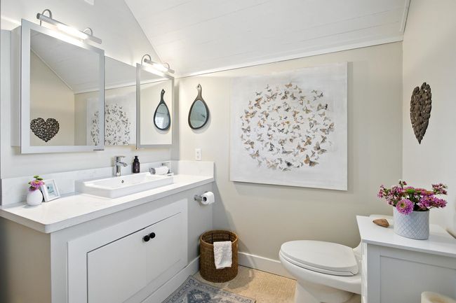 Bathroom with baseboards, toilet, vanity, and lofted ceiling | Image 24
