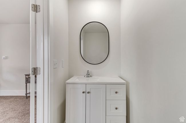 Bathroom featuring vanity and baseboards | Image 14