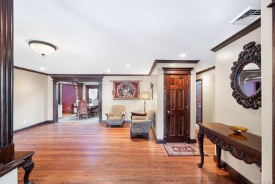 Foyer featuring ornamental molding and hardwood / wood-style flooring | Image 2