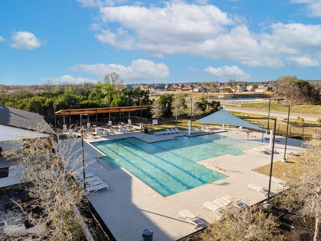 Pool with a patio and fence | Image 34