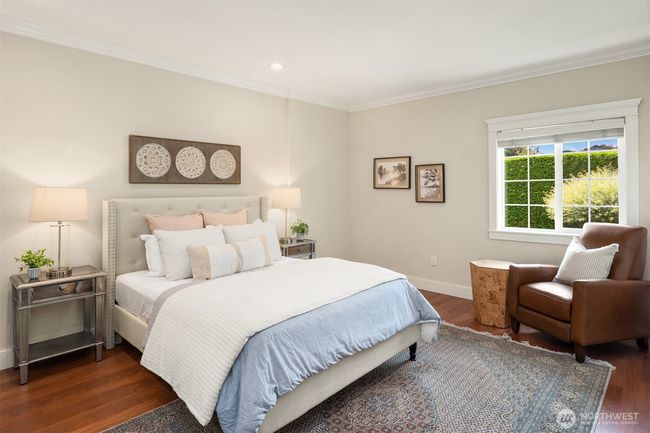 Main floor primary suite with walk-in closet and 3/4 bath. | Image 15