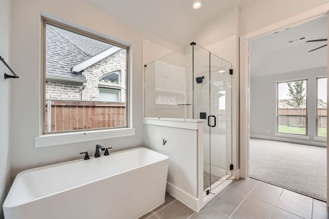 Bathroom with tile patterned flooring, recessed lighting, a shower stall, a soaking tub, and visible vents | Image 18