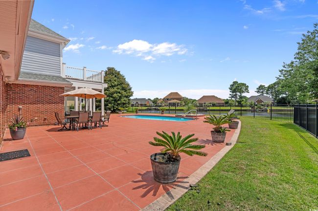 Patio / terrace with a patio area and a fenced backyard | Image 14