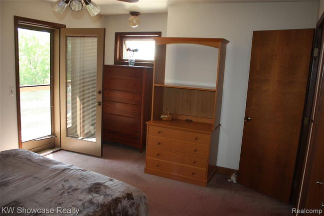 Second bedroom with door to private balcony. | Image 33