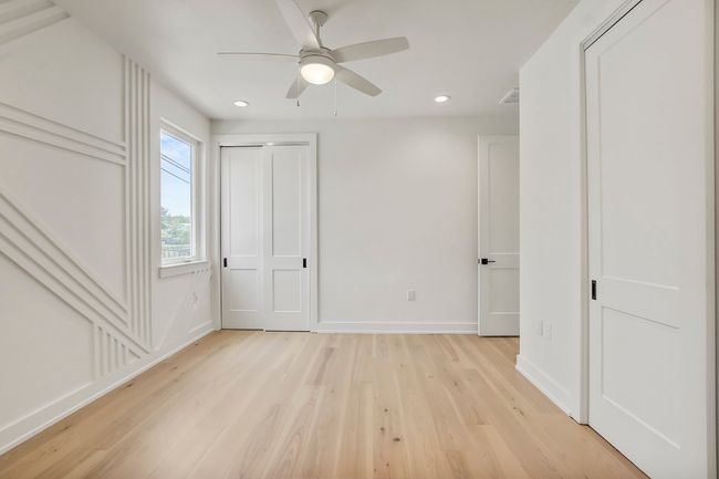 Unfurnished bedroom with light wood finished floors, recessed lighting, baseboards, and ceiling fan | Image 18