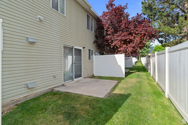 Fenced backyard featuring a patio | Image 28