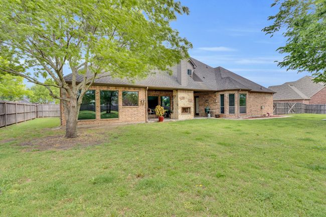 Back of house featuring large yard and mature trees | Image 39