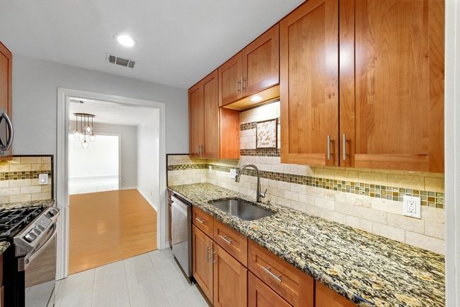 Kitchen with view to Dining room and Sun room | Image 19