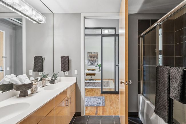 Fashionable dark tile on the floors and in the shower.jpg | Image 36