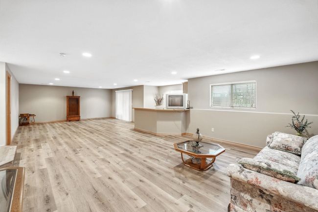 Living room featuring recessed lighting, light wood-style floors, and baseboards | Image 21