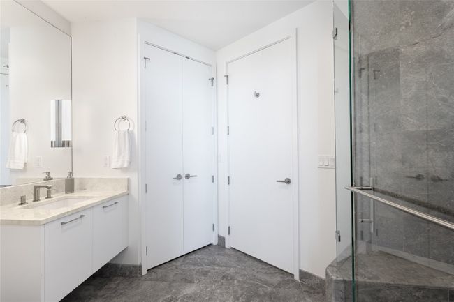 Bathroom with vanity and a shower stall | Image 23