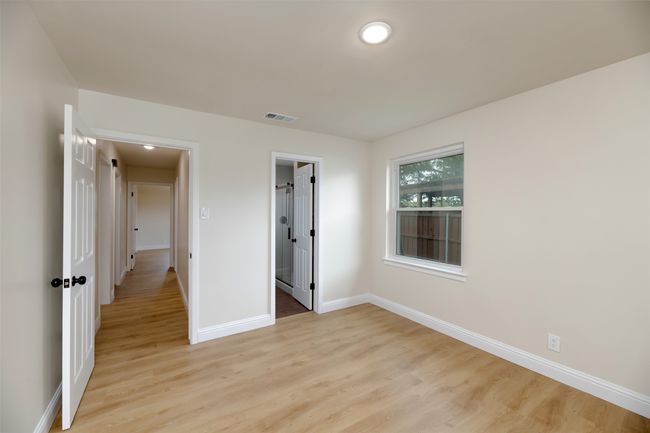 Unfurnished bedroom featuring light wood-style flooring, baseboards, and recessed lighting | Image 12