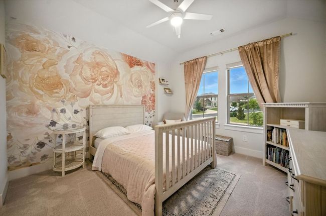 Upstairs Bedroom featuring carpet, lofted ceiling, and ceiling fan | Image 34