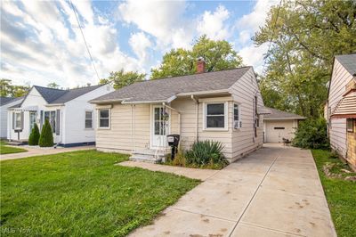 View of front of property with a garage and a front lawn | Image 3