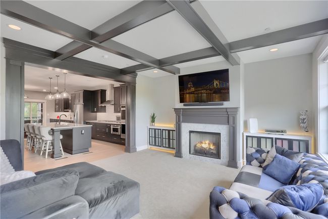 Another view of the kitchen showing the flow into the family room and truly showing the size, space and style of this space. | Image 21