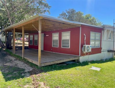 You could be THIS CLOSE to the water! Lakeview across the neighbor's yard from the covered front deck! | Image 1