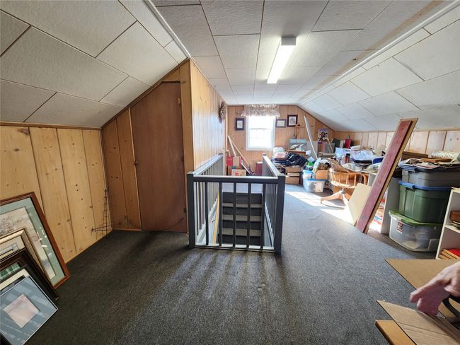 Bonus room with carpet flooring, vaulted ceiling, and wooden walls | Image 36
