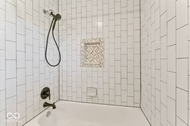 bathroom featuring shower / bathtub combination | Image 25