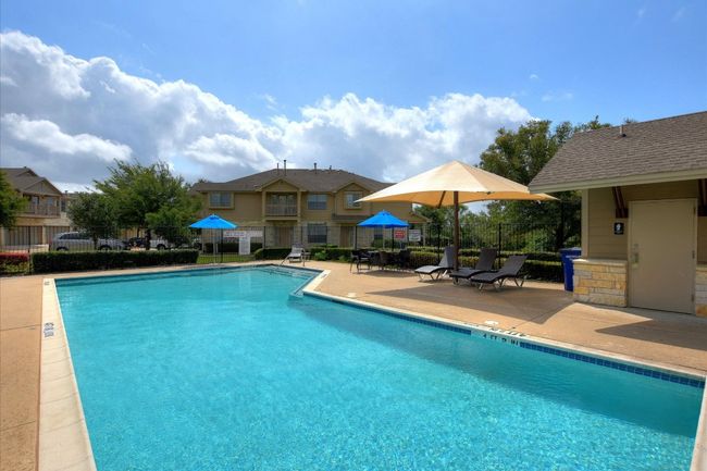 Community pool with a patio | Image 20