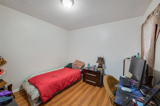 Unit A Bedroom with wood-type flooring and a textured ceiling | Image 32
