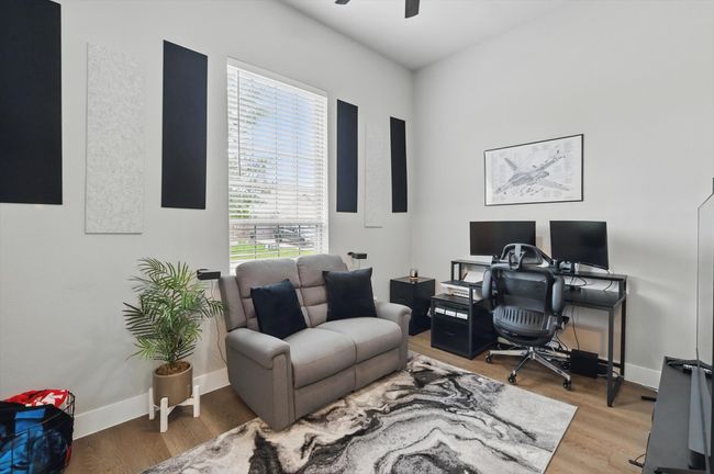 Office area with wood finished floors and ceiling fan | Image 6