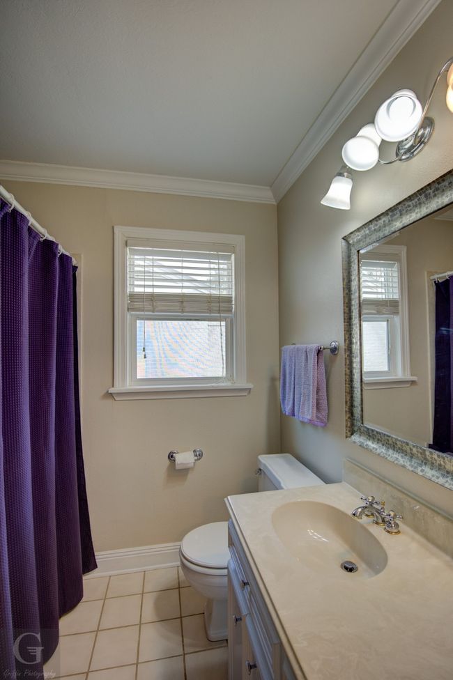 Full bath featuring a healthy amount of sunlight, tile patterned flooring, ornamental molding, and toilet | Image 24