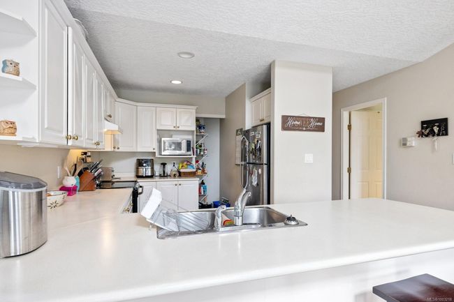 UP STAIRS ON MAIN FLOOR KITHEN WITH LOTS OF COUNTER SPACE | Image 11