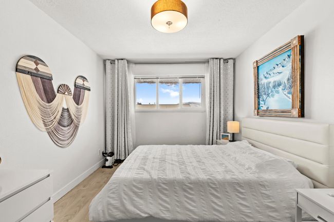 Bedroom featuring light wood finished floors and baseboards | Image 21