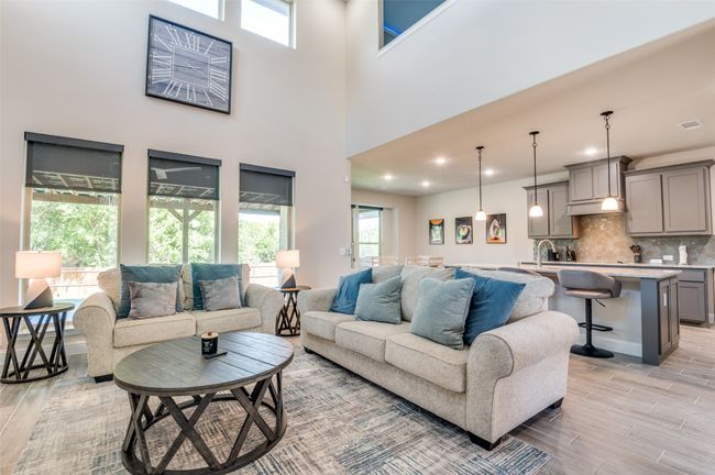 Living room with plenty of natural light, wood tiled floors, and recessed lighting | Image 6